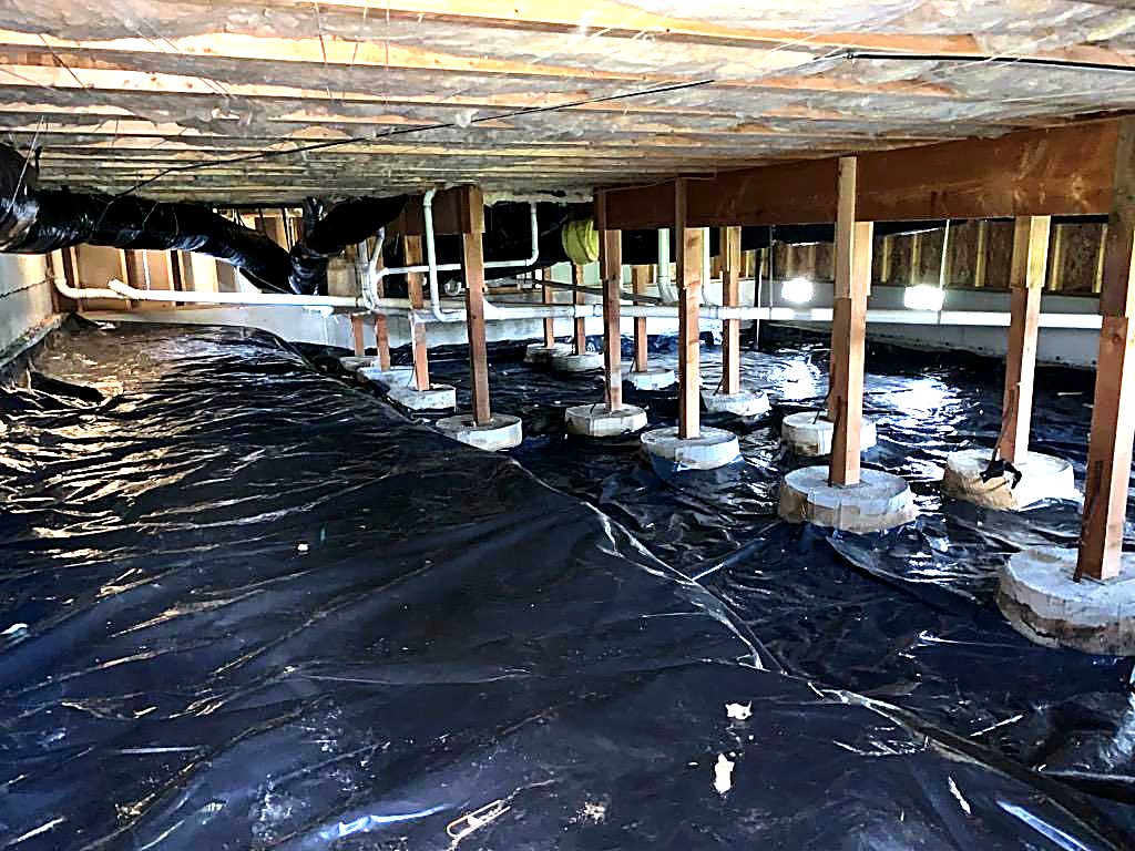 Old ground cover and piers before replacement