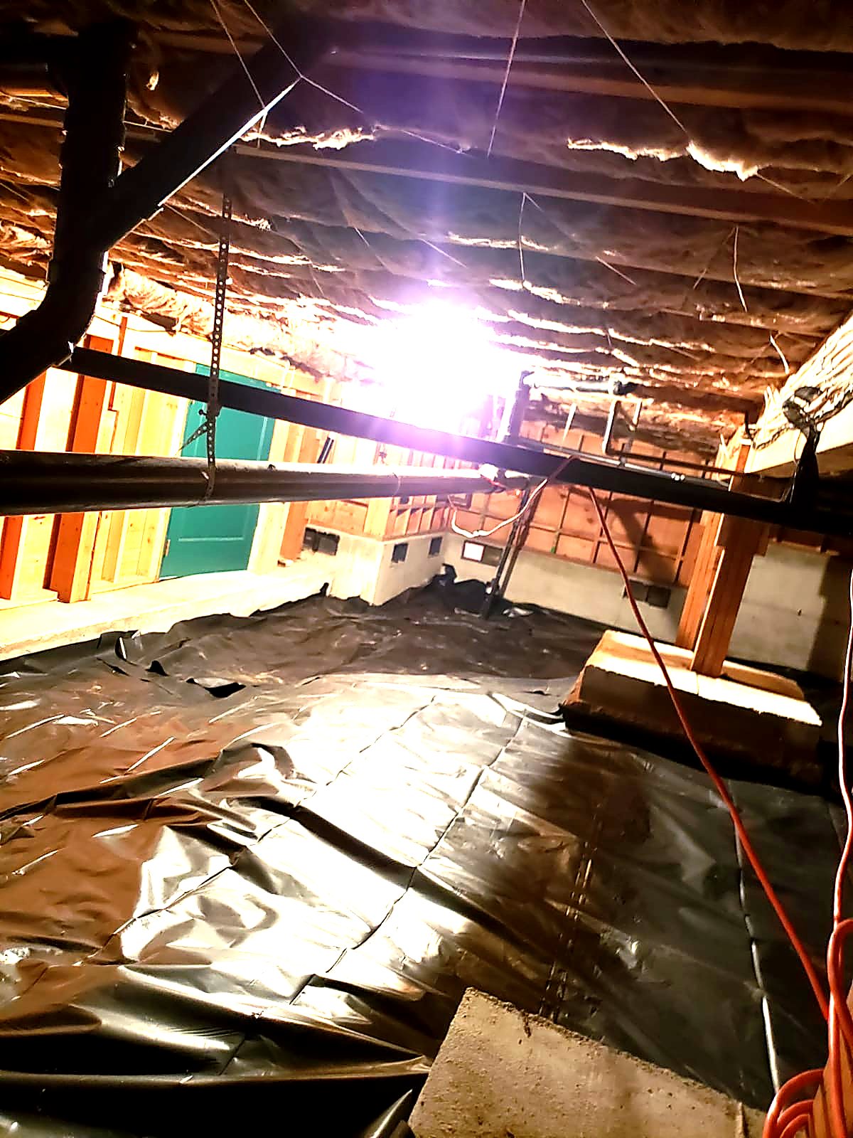 Old crawl space material before removal