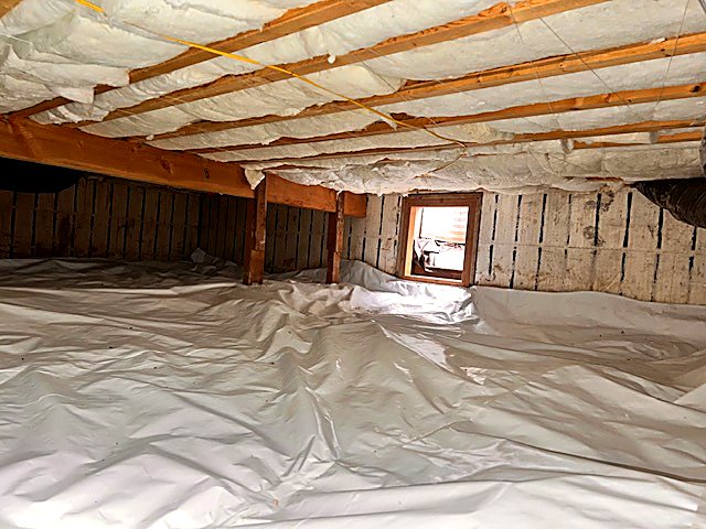 Crawl space finished with fresh under-floor insulation