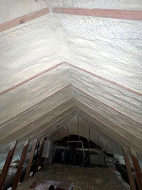 Spray foam sealing an attic corner