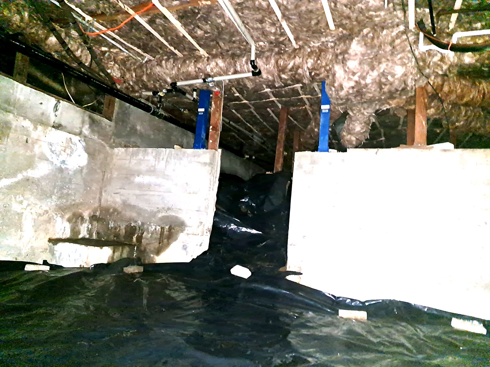 Crawl space with standing water before remediation