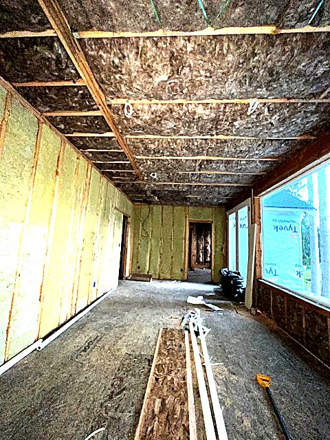Framed lower level prepared for wall insulation