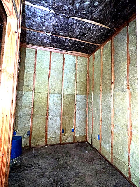 Wall cavities insulated before drywall
