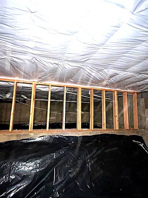 Vapor barrier carried up to the crawl space access