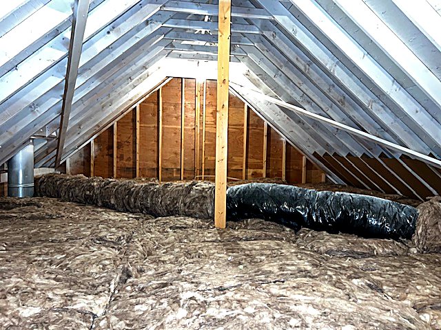 Attic insulation around ducting and framing