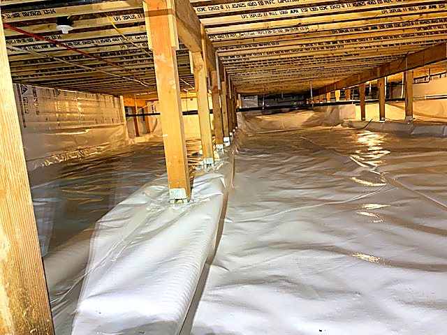 Wide crawl space finished with new ground cover