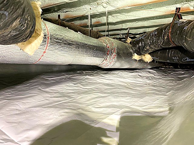 Insulated flexible ductwork above a new ground cover