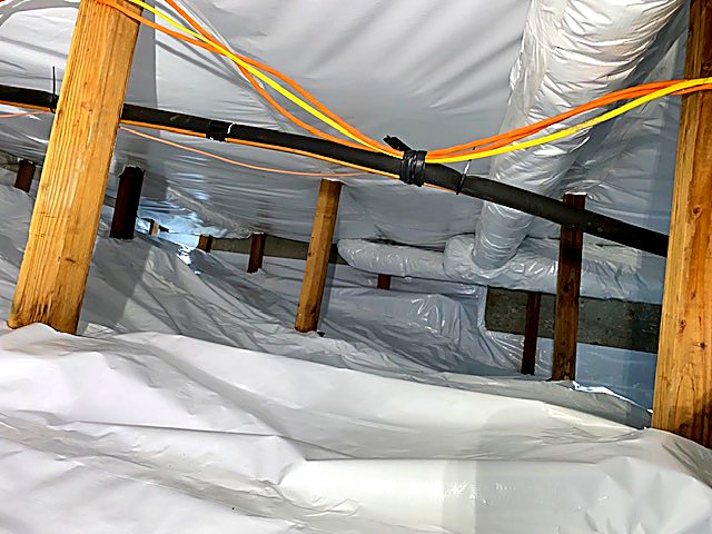 Insulation supported around a crawl space beam