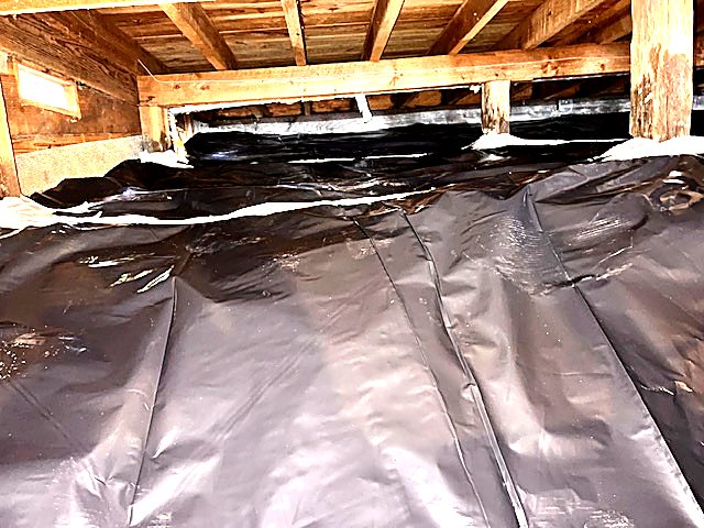 Ground cover run wall to wall in a tight crawl space
