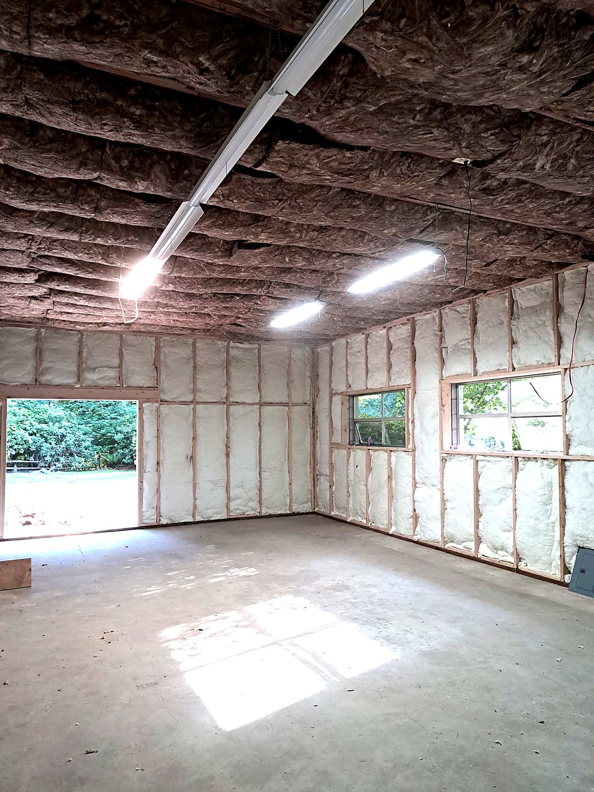 Insulated walls and ceiling in a converted outbuilding