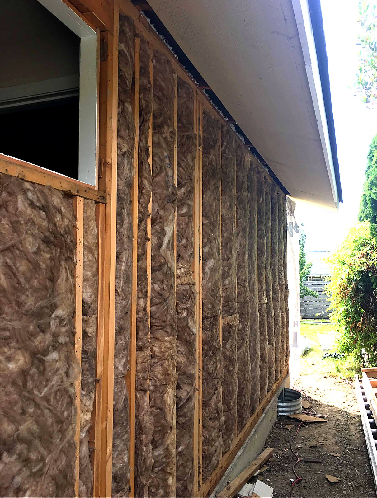 Exterior wall cavities insulated during a remodel
